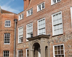 Sunny exterior of Earlham hall at the University of East Anglia