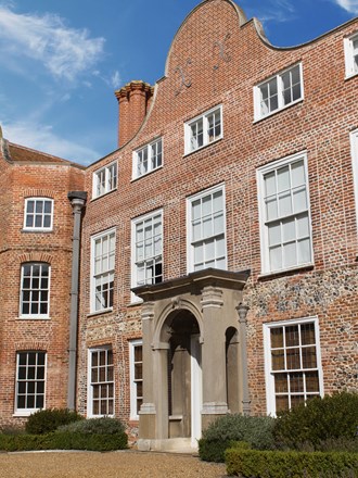 Sunny exterior of Earlham hall at the University of East Anglia