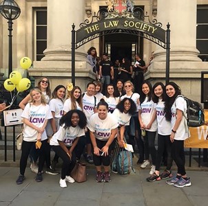 A group photo of students standing outside the Law Society