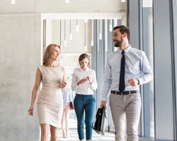 Professionals walking through a modern office 